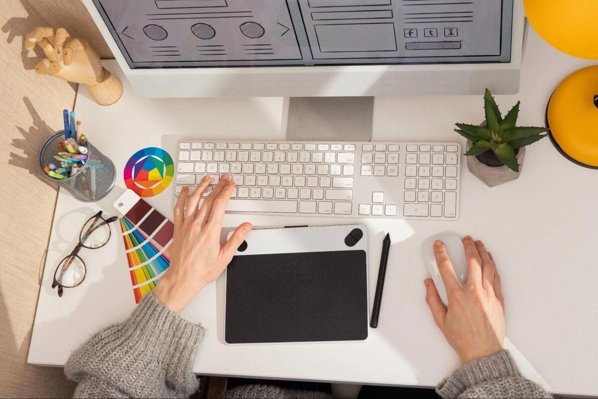 Web designer reviewing plugins and scripts that slow down website loading speed