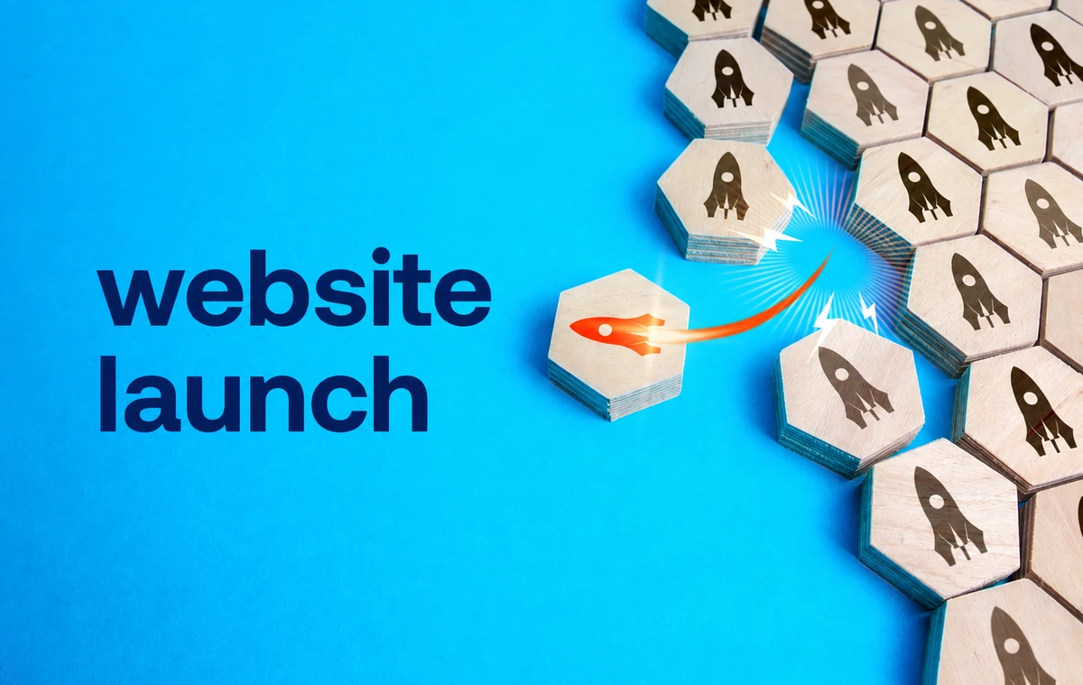 website-launch-checklist-graphic Website launch graphic with hexagon tiles and rocket icons on a blue background